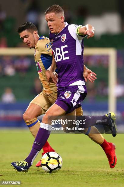 Shane Lowry of the Glory controls the ball against Dimitri Petratos of the Jets during the round 10 A-League match between the Perth Glory and the...