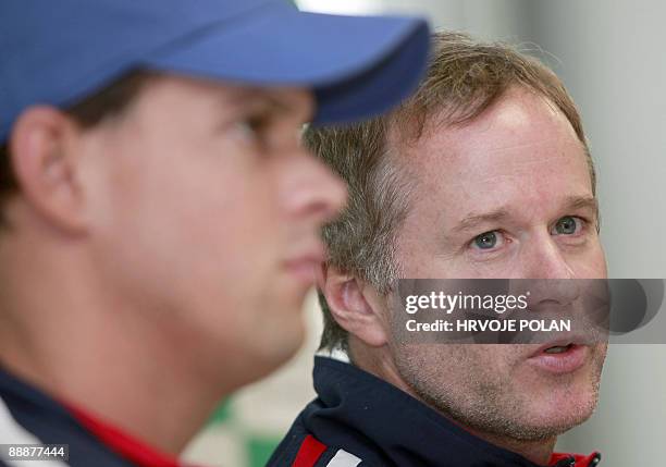 Davis Cup team captain Patrick McEnroe talks to journalists next to the player Bob Bryan during the team�s press conference in northern Croatian...