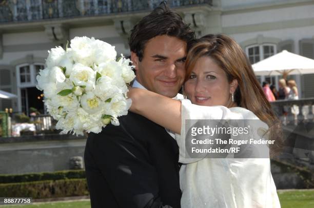 Roger Federer and Mirka Vavrinec embrace after their wedding on April 11, 2009 in Basel, Switzerland.
