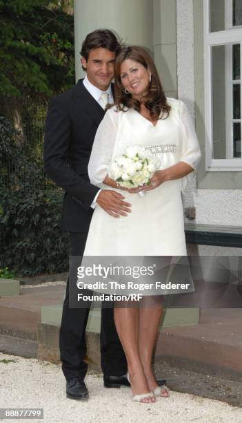 Roger Federer and Mirka Vavrinec pose after their wedding on April 11, 2009 in Basel, Switzerland.