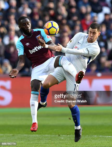 Arthur Masuaku of West Ham United is challenged by Eden Hazard of Chelsea during the Premier League match between West Ham United and Chelsea at...