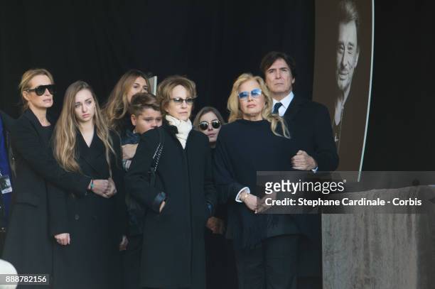 Estelle Lefebure, his daughter Ilona Smet, Nathalie Baye, Sylvie Vartan and Tony Scotti during Johnny Hallyday's Funeral Procession at Eglise De La...