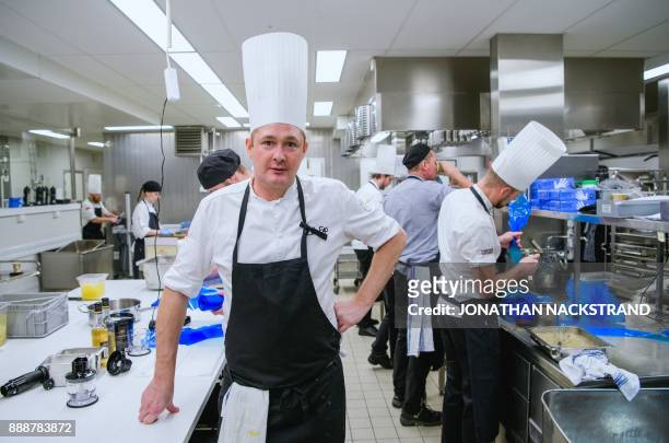 The 2017 Nobel Banquet head chef Tom Sjöstedt poses for a picture works in the kitchen of the Stockholm city hall on December 7, 2017. / AFP PHOTO /...