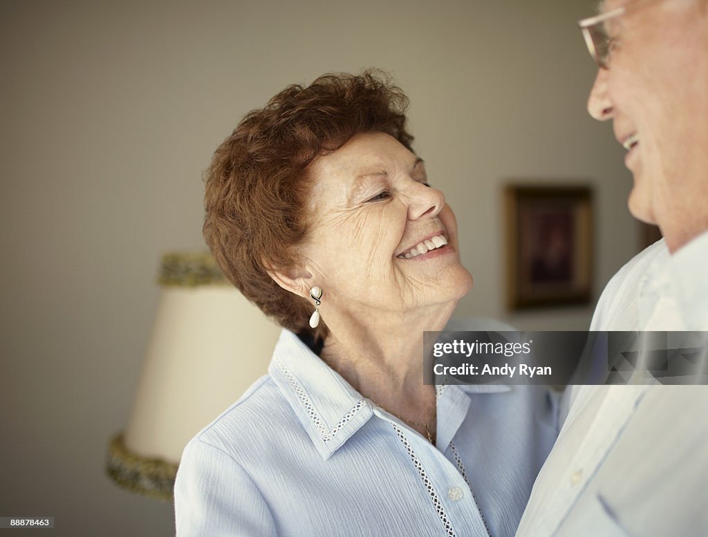 Senior couple smiling, enjoying each other