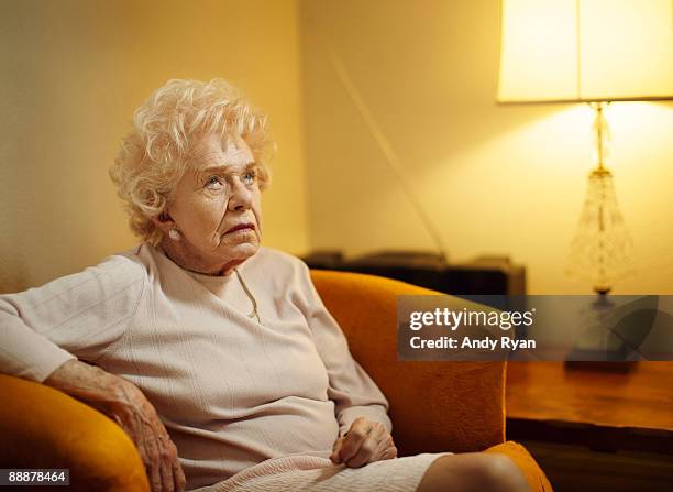 senior woman rolling hereyes - impatient stock-fotos und bilder