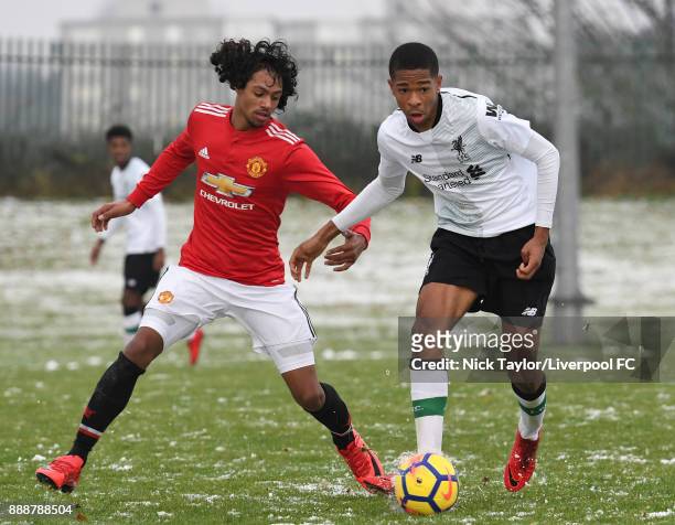 Elijah Dixon-Bonner of Liverpool and D'Mani Mellor of Manchester United in action during the Manchester United v Liverpool U18 Premier League game at...