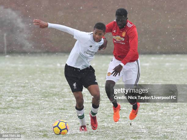 Elijah Dixon-Bonner of Liverpool and Aliou Traore of Manchester United in action during the Manchester United v Liverpool U18 Premier League game at...