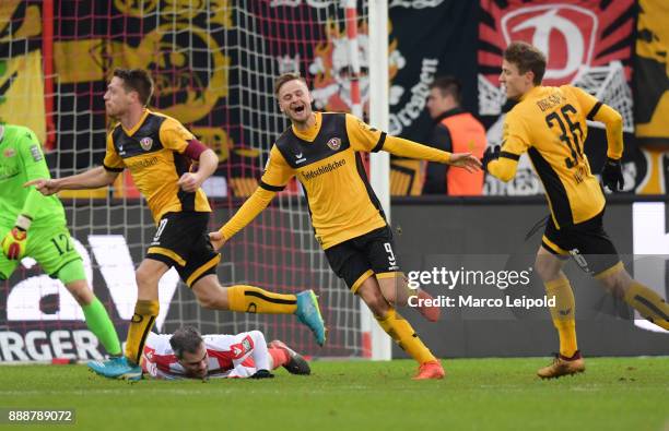 Andreas Lambertz, Lucas Roeser and Niklas Hauptmann of SG Dynamo Dresden celebrate after scoring the 0:1 goal during the Second Bundesliga match...