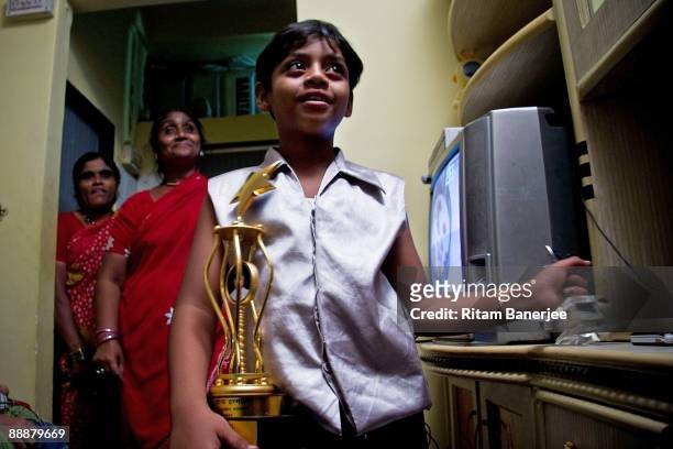 Mohammed Azharuddin Ismail, child star of the Oscar winning 'Slumdog Millionaire' celebrating his newly allocated 250 square foot apartment by 'Jai...