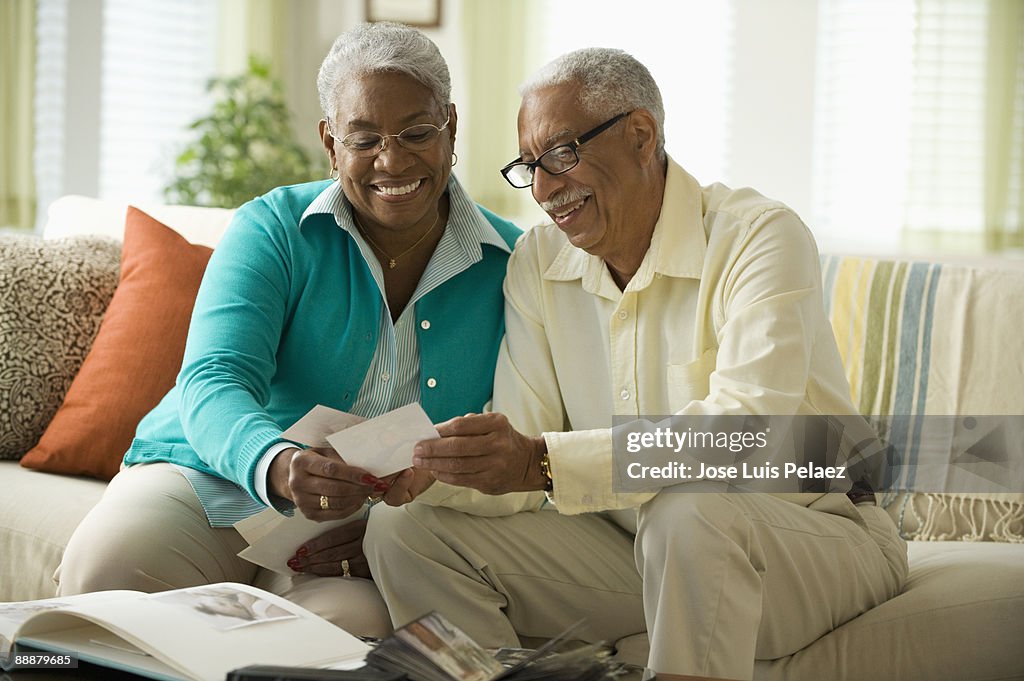 Elderly couple looking at pictures