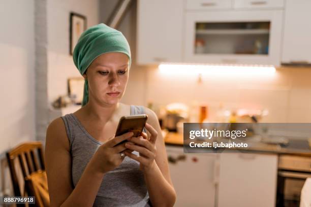 portrait of chemo woman - cellphone cancer illness stock pictures, royalty-free photos & images