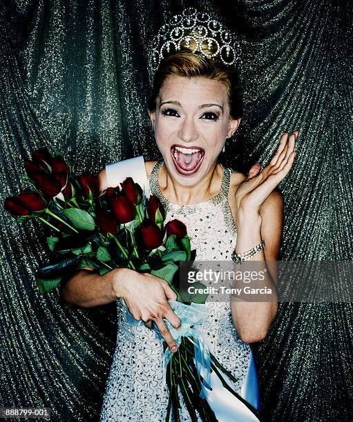 woman winning beauty contest, holding red roses (cross-processed) - beauty pageant crown stock-fotos und bilder
