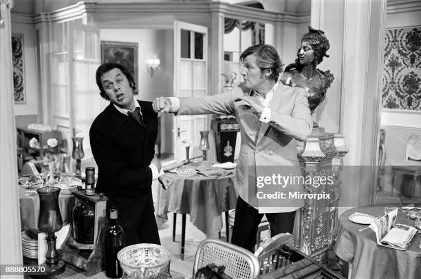 Roger Moore and Tony Curtis fight with each other on the set of The Persuaders! at Pinewood Film Studios, Iver, Bucks. Roger plays an English Lord,...