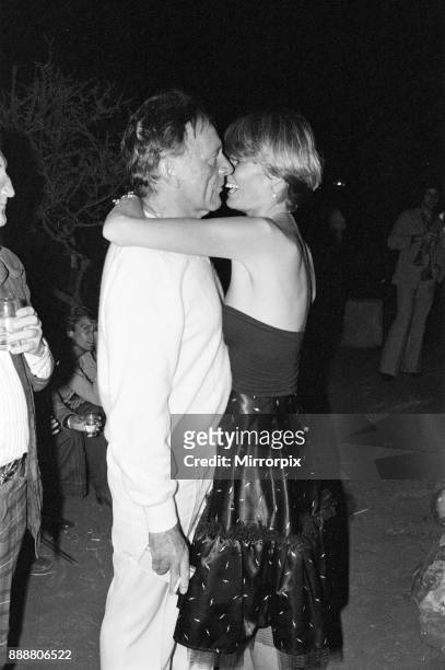 Roger Moore's 50th Birthday Party in the bush near Tshipise, South Africa, during the filming of his latest film 'Wild Geese.' Richard Burton and his...