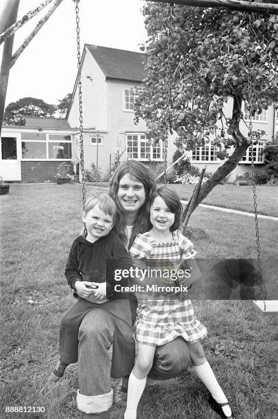 Ozzy Osbourne singer with the Heavy Metal band Black Sabbath seen here at home with his children Jessica and Louis, 19th August 1978.