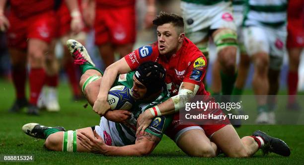 Marco Lazzaroni of Benetton Rugby is tackled by Steffan Evans of Scarlets during the European Rugby Champions Cup match between Scarlets and Benetton...