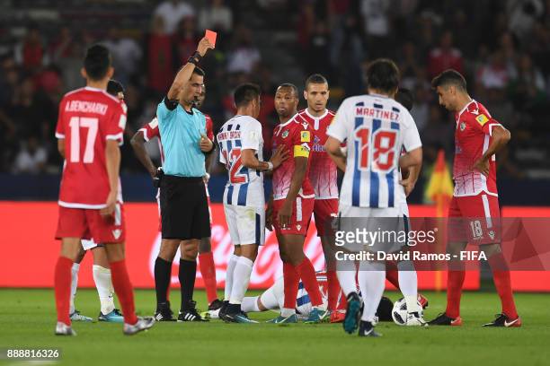Brahim Nekkach of Wydad Casablanca is shown a red card by referee Ravshan Irmatov during the FIFA Club World Cup match between CF Pachuca and Wydad...