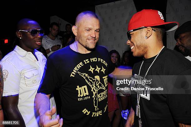 Antonio Tarver, Chuck Liddell and Nelly attend Jet nightclub at The Mirage Hotel and casino Resort on July 6, 2009 in Las Vegas, Nevada.