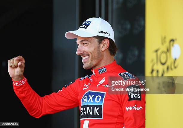 Fabian Cancellara of Switzerland and Team Saxo Bank jokes about his slender race lead after stage four of the 2009 Tour de France, a 39km Team Time...