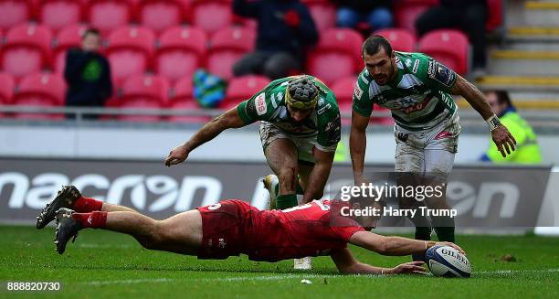 Paul Asquith of Scarlets scores his sides fifth and winning try during the European Rugby Champions Cup match between Scarlets and Benetton Rugby at...