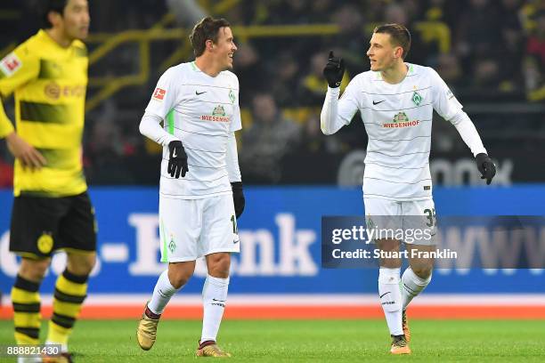 Martin Eggestein of Bremen celebrates with Max Kruse of Bremen after he scored a goal to make it 1:0 during the Bundesliga match between Borussia...