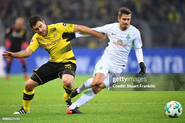 Sokratis Papastathopoulos of Dortmund fights for the ball with Fin Bartels of Bremen during the Bundesliga match between Borussia Dortmund and SV...