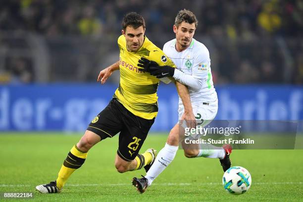 Sokratis Papastathopoulos of Dortmund fights for the ball with Fin Bartels of Bremen during the Bundesliga match between Borussia Dortmund and SV...
