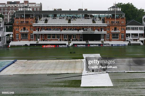 Rain and hail fall on the outfield as play is abandoned due to a thunder and hail storm during the fifth One Day International match between England...