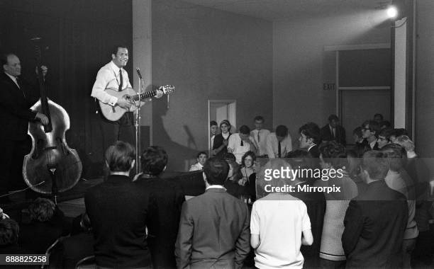 Cy Grant performs at a folk singing club in a Methodist Church, Kings Cross, 13th January 1967.