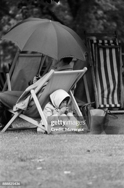 Mid-summer's day at St James's Park, 4 year old Alison makes her first trip to London with her father, and had to shelter beneath her father's deck...