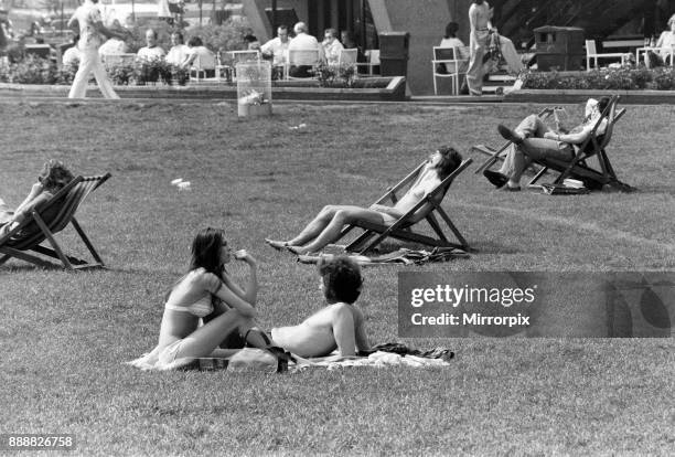 The temperatures rose into the upper 70's again today and crowds flocked to sunbathe and relax in Hyde Park, London, 7th May 1976.