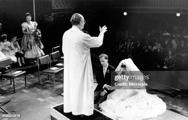 Canon Nicholas Freyling performs the wedding blessing of Andy Gale and Carrie Stevens at Liverpool Playhouse, 19th July 1992.