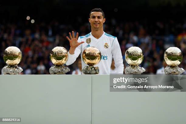Cristiano Ronaldo of Real Madrid CF poses with his five Golden Ball trophies prior to start the La Liga match between Real Madrid CF and Sevilla FC...