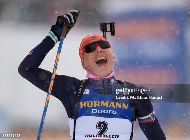 Anastasiya Kuzmina of Slovakia celebrates crossing the finish line of the 10 km Women's Pursuit during the BMW IBU World Cup Biathlon on December 0,...