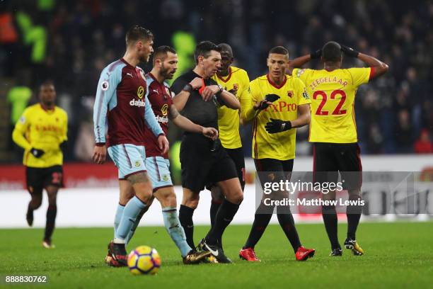 Marvin Zeegelaar of Watford reacts to being shown a red card by referee Lee Probert during the Premier League match between Burnley and Watford at...