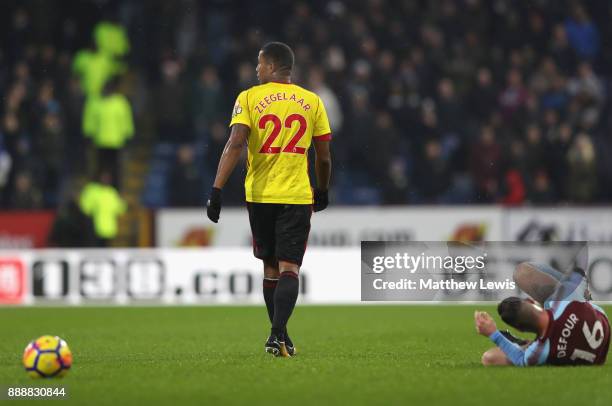 Marvin Zeegelaar of Watford walks off after fouling Steven Defour of Burnley which he later is sent off for during the Premier League match between...