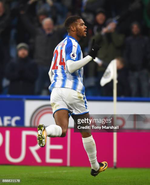 Steve Mounie of Huddersfield Town celebrates after scoring his sides second goal during the Premier League match between Huddersfield Town and...