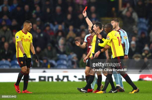 Marvin Zeegelaar of Watford is shown a red card by referee Lee Probert during the Premier League match between Burnley and Watford at Turf Moor on...
