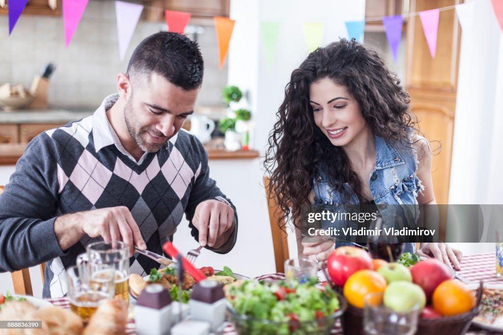 Young couple eating together