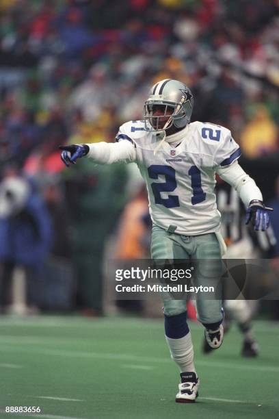 Deion Sanders of the Dallas Cowboys looks on during a NFL football game against the New York Giants on October 5, 1997 at Giants Stadium in East...
