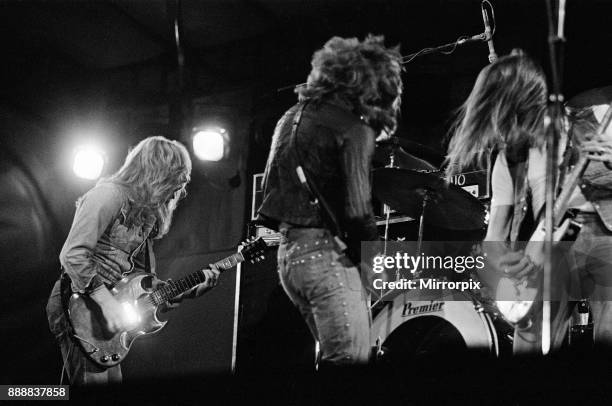 Status Quo perform at The Reading Festival on Saturday 25th August 1973. Picture shows Rick Parfitt Alan Lancaster and Francis Rossi The festival was...