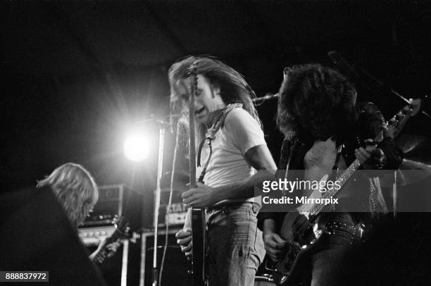 Status Quo perform at The Reading Festival on Saturday 25th August 1973. Picture shows Rick Parfitt and Francis Rossi and bass player Alan Lancaster...