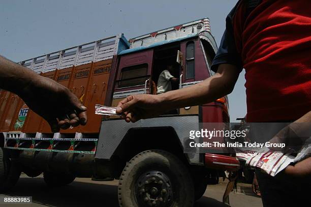 Social worker distributing condom at Sanjay Gandhi Transport Nagar in New Delhi