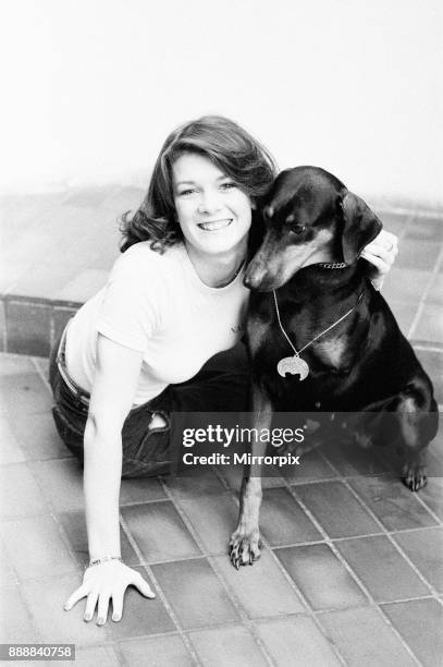 Killer's Moon, photo-call to promote new film, London, 15th November 1978. Pictured, actress in film, Lisa Vanderpump aged 17, with doberman pinscher...