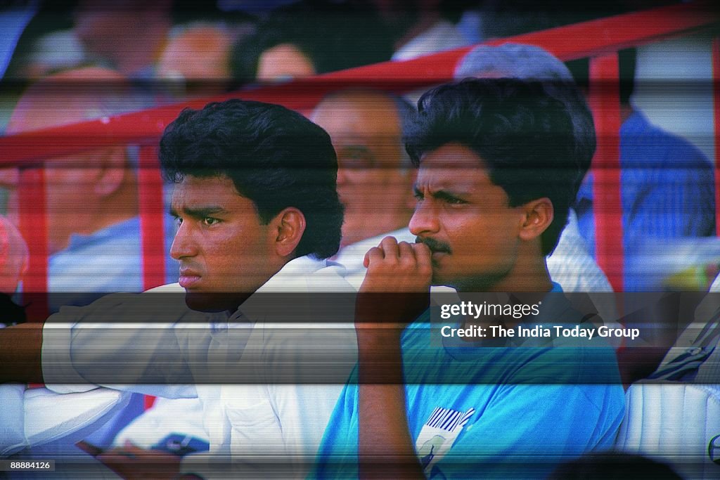 Sanjay Manjrekar with Javagal Srinath sitting in the stands and watching the match ( Cricket, News Portrait )