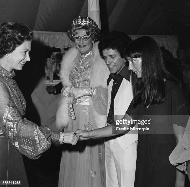 Queen Elizabeth II, Dame Edna Everage and Leo Sayer attend the Royal Windsor Big Top Show held at Billy Smart's Big Top in Home Park, Windsor, in aid...