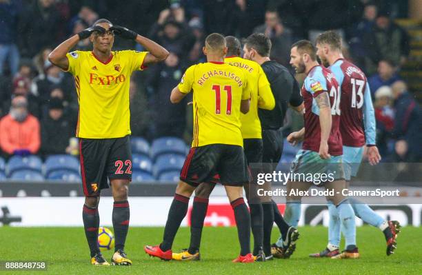 Watford's Marvin Zeegelaar reacts after being sent off by referee Lee Probert during the Premier League match between Burnley and Watford at Turf...
