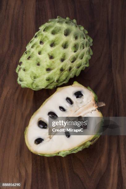 cherimoya on wood - cherimoya stockfoto's en -beelden