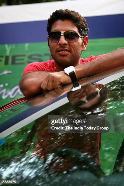 Indian cricketer Yuvraj Singh with his new Ford Fiesta car at Taj Mansingh hotel, New Delhi. He got the car, Ford Fiesta, from ford's GM, Nalin...