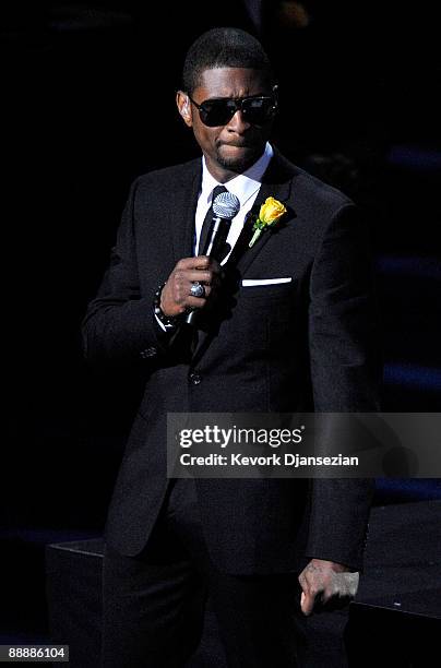 Singer Usher performs at the Michael Jackson public memorial service held at Staples Center on July 7, 2009 in Los Angeles, California. Jackson the...